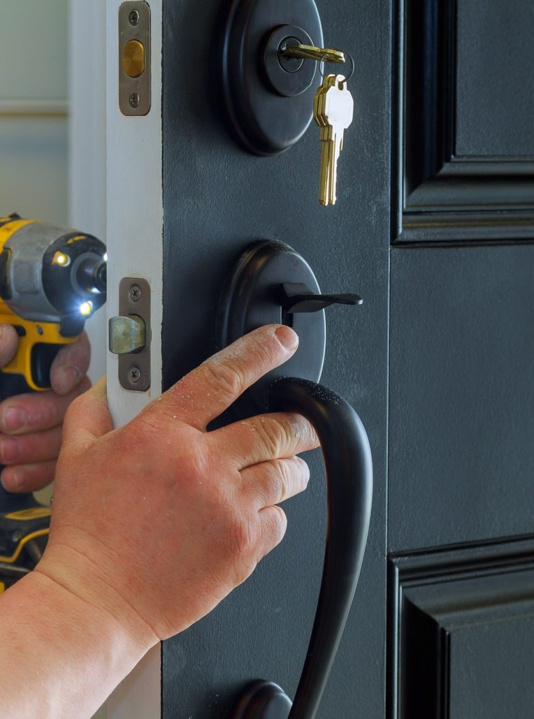 locksmith repairing door lock